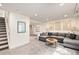 Basement living room with comfortable seating, carpet flooring, and natural lighting at 23813 Broadmoor Dr, Parker, CO 80138