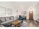 Cozy living room with hardwood floors, comfortable seating, and natural light at 23813 Broadmoor Dr, Parker, CO 80138