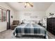 Serene main bedroom with a ceiling fan, large window, and plush carpeting at 23813 Broadmoor Dr, Parker, CO 80138