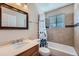 Bathroom featuring a vanity, mirror, toilet, and shower with tile surround at 14798 E Temple Dr, Aurora, CO 80015