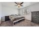 Bedroom featuring neutral carpet and a large window for natural light at 14798 E Temple Dr, Aurora, CO 80015