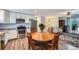 Open layout kitchen with stainless steel appliances, connected to the living room at 14798 E Temple Dr, Aurora, CO 80015