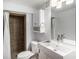 Bathroom features a shower stall with tiled walls and modern fixtures at 865 S Dale Ct, Denver, CO 80219