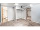 Carpeted room featuring open closet area, neutral paint, and bright lighting at 865 S Dale Ct, Denver, CO 80219