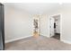 Spacious bedroom with a doorway leading to stairs and an en-suite bathroom at 1385 N King St, Denver, CO 80204