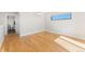 Sunlit bedroom showcasing beautiful hardwood floors, a modern window, and a clean, minimalist design at 1385 N King St, Denver, CO 80204