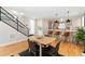 Bright dining area featuring hardwood floors, modern décor, and an open layout to the kitchen at 1385 N King St, Denver, CO 80204