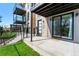 Close-up of modern townhome entrance with stone accents, private patio, and sliding glass doors at 1385 N King St, Denver, CO 80204