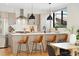 Modern kitchen featuring a central island, stainless steel appliances, and stylish pendant lighting at 1385 N King St, Denver, CO 80204
