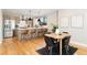 Modern kitchen featuring stainless steel appliances, light wood cabinets, and a breakfast bar at 1385 N King St, Denver, CO 80204