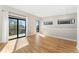 Open living room with hardwood floors, large windows, and balcony access for seamless indoor/outdoor living at 1385 N King St, Denver, CO 80204