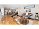 Open-concept living and kitchen area with hardwood floors, modern furniture, and stainless steel appliances at 1385 N King St, Denver, CO 80204