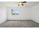 Bright bedroom featuring neutral carpet, a ceiling fan, and a window that offers great natural lighting at 2253 Coronado Pkyn # D, Denver, CO 80229
