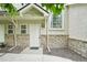 Charming townhome with stone accents, a bright window, and a welcoming front entrance, all in a well-maintained exterior at 2253 Coronado Pkyn # D, Denver, CO 80229