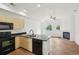 Bright kitchen featuring stainless steel appliances, granite countertops, and an open layout to the living room at 2253 Coronado Pkyn # D, Denver, CO 80229