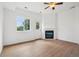 Bright living room with hardwood floors, a cozy fireplace, and ample natural light at 2253 Coronado Pkyn # D, Denver, CO 80229