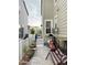 The backyard offers a relaxing brick patio with a swing and comfortable seating for enjoying the outdoors at 5126 Buckwheat Rd, Brighton, CO 80640