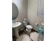 Inviting bathroom with pedestal sink, natural light, and tasteful decor creates a relaxing retreat at 5126 Buckwheat Rd, Brighton, CO 80640