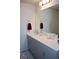 Bathroom with modern vanity, neutral color palette, and sleek fixtures, creates a serene atmosphere at 5126 Buckwheat Rd, Brighton, CO 80640