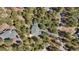 Aerial view of home surrounded by trees, showing roof and driveway at 20050 Lost Arrowhead Dr, Monument, CO 80132