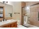 Bathroom with stylish fixtures and a tiled shower with sliding glass doors at 20050 Lost Arrowhead Dr, Monument, CO 80132