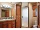Well appointed bathroom with tile floors, quartz counters and a large glass enclosed shower at 20050 Lost Arrowhead Dr, Monument, CO 80132