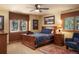 Comfortable bedroom with wood trim, plush bedding, and a ceiling fan for added comfort at 20050 Lost Arrowhead Dr, Monument, CO 80132