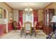 Formal dining room featuring elegant wood furniture and charming decor at 20050 Lost Arrowhead Dr, Monument, CO 80132
