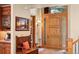 Warm, inviting foyer featuring beautiful wood accents and ample natural light at 20050 Lost Arrowhead Dr, Monument, CO 80132