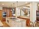 Spacious kitchen featuring stone countertops, custom cabinetry, and a large center island at 20050 Lost Arrowhead Dr, Monument, CO 80132
