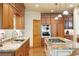Gourmet kitchen featuring wood cabinetry, granite countertops, and stainless steel appliances at 20050 Lost Arrowhead Dr, Monument, CO 80132