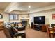 Spacious living room features a fireplace, plush seating, and a large screen television at 20050 Lost Arrowhead Dr, Monument, CO 80132