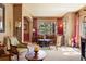 Comfortable living room featuring elegant decor, large windows with lots of light, and plush furnishings at 20050 Lost Arrowhead Dr, Monument, CO 80132