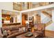 Spacious living room featuring a staircase and an open floor plan at 20050 Lost Arrowhead Dr, Monument, CO 80132