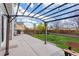 Backyard featuring a concrete patio with a pergola, string lights, and a well-maintained lawn at 134 Laramie Ct, Castle Rock, CO 80104