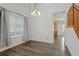 Dining room featuring dark wood floors, a window, and chandelier at 134 Laramie Ct, Castle Rock, CO 80104