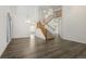 Open entryway with dark wood floors, high ceilings, a staircase, and a chandelier at 134 Laramie Ct, Castle Rock, CO 80104