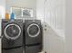 Convenient laundry room with modern washer and dryer, natural light and easy access to other rooms at 134 Laramie Ct, Castle Rock, CO 80104