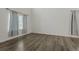 Spacious room featuring dark wood floors, large window, and neutral wall paint at 134 Laramie Ct, Castle Rock, CO 80104