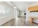 Open concept living space featuring wood floors, neutral walls, built-in shelves, and a fireplace at 134 Laramie Ct, Castle Rock, CO 80104