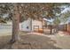 The backyard has a cozy deck, large trees and offers outdoor living at 7661 Gray Way, Arvada, CO 80003