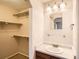 Bathroom featuring single sink vanity and closet at 7661 Gray Way, Arvada, CO 80003