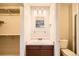 Bathroom with single sink vanity, closet and toilet at 7661 Gray Way, Arvada, CO 80003