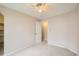 Bedroom featuring ceiling fan and an entry to an ensuite bathroom at 7661 Gray Way, Arvada, CO 80003