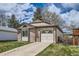 Charming single-Gathering home boasts a manicured lawn, brick accents, and an attached garage at 7661 Gray Way, Arvada, CO 80003