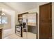 A kitchen featuring stainless steel appliances, dark wood cabinets and tile flooring at 7661 Gray Way, Arvada, CO 80003