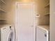 Convenient laundry area with modern washer and dryer and added storage space at 7661 Gray Way, Arvada, CO 80003