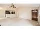 Bright living room features an open concept design, neutral decor, and easy access to kitchen at 7661 Gray Way, Arvada, CO 80003