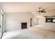 Spacious living room features vaulted ceilings, a cozy fireplace, and abundant natural light at 7661 Gray Way, Arvada, CO 80003