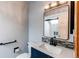 Modern bathroom featuring a new sink, a vanity, and a stylishly framed mirror at 12480 W Nevada Pl # 214, Lakewood, CO 80228